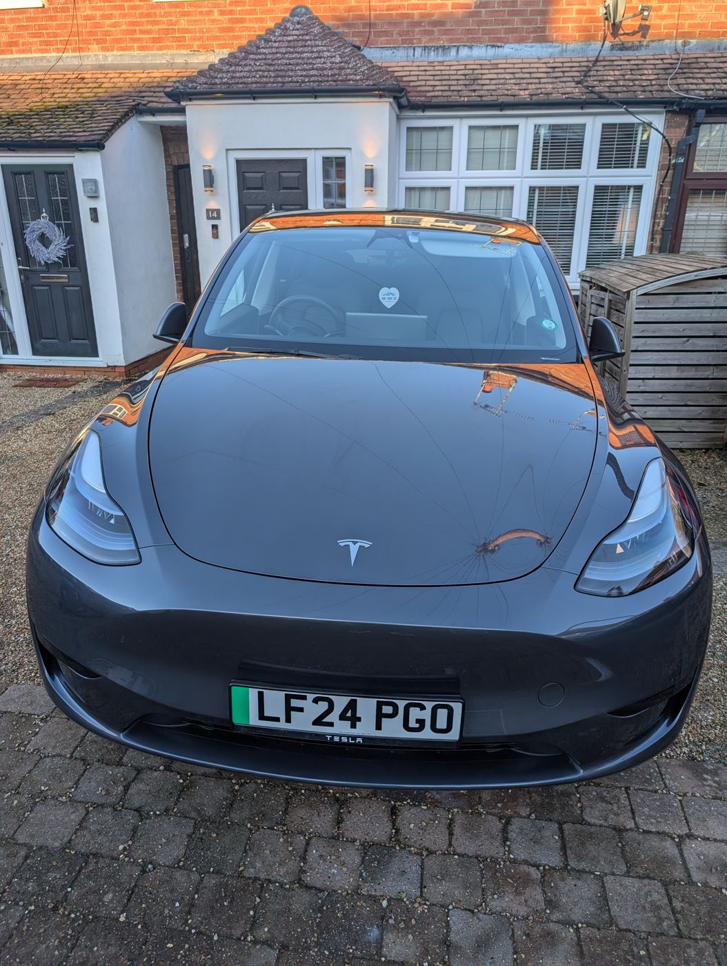 Freshly washed car on a driveway